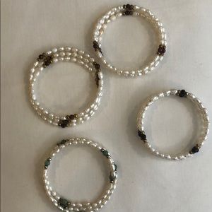Four memory wire, freshwater pearl bracelets.